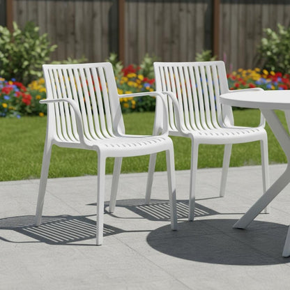 Set of Two White Heavy Duty Plastic Outdoor Stacking Arm Chairs HomeRoots