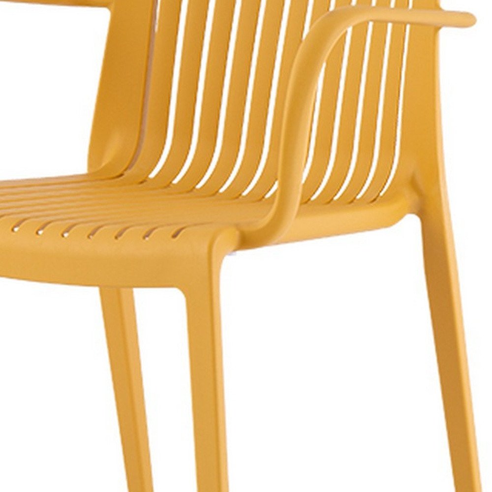 Set of Two Yellow Heavy Duty Plastic Outdoor Stacking Arm Chairs HomeRoots