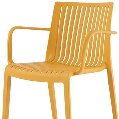 Set of Two Yellow Heavy Duty Plastic Outdoor Stacking Arm Chairs HomeRoots