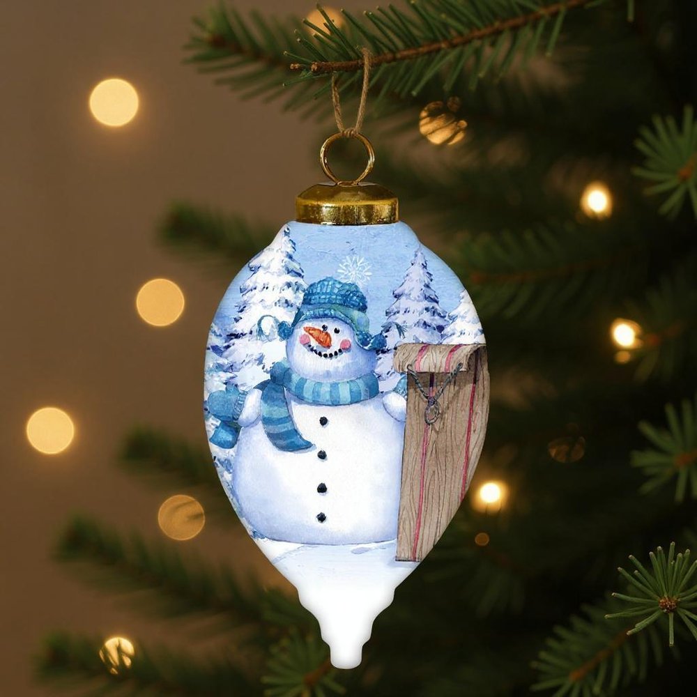 Sled Snowman Hand Painted White Blue And Brown Glass Finial Ornament HomeRoots