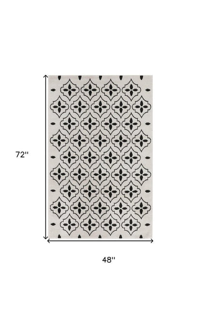 4' X 6' Ivory And Black Geometric Indoor Outdoor Area Rug
