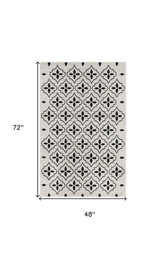 4' X 6' Ivory And Black Geometric Indoor Outdoor Area Rug