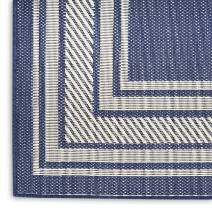 4' X 6' Navy Blue And Ivory Geometric Indoor Outdoor Area Rug
