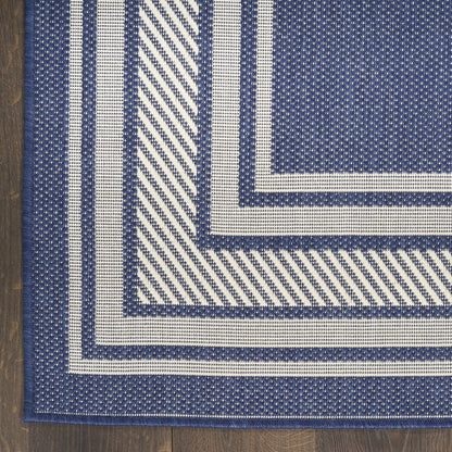 4' X 6' Navy Blue And Ivory Geometric Indoor Outdoor Area Rug