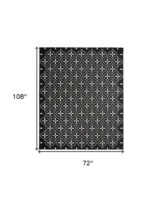 6' X 9' Black And Ivory Geometric Indoor Outdoor Area Rug