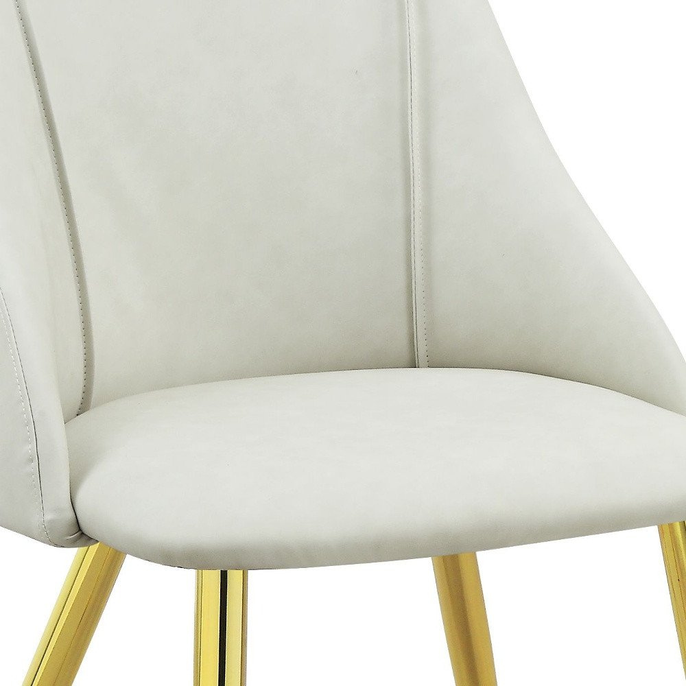 Set of Two White and Gold Upholstered Faux Leather And Metal Dining Side Chairs HomeRoots
