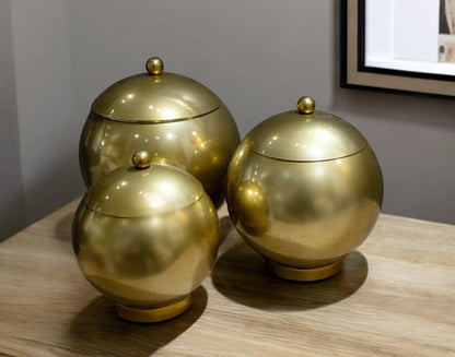 Set of Three Gold Metal Decorative Lidded Canisters HomeRoots