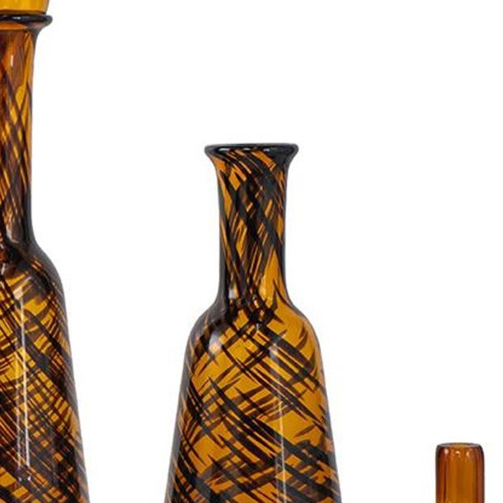 Set of Three Amber Abstract Swirl Glass Decorative Bottles With Stoppers HomeRoots