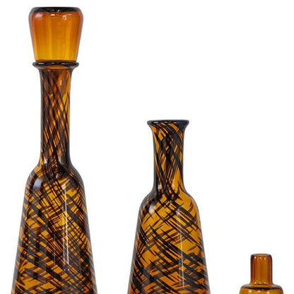 Set of Three Amber Abstract Swirl Glass Decorative Bottles With Stoppers HomeRoots