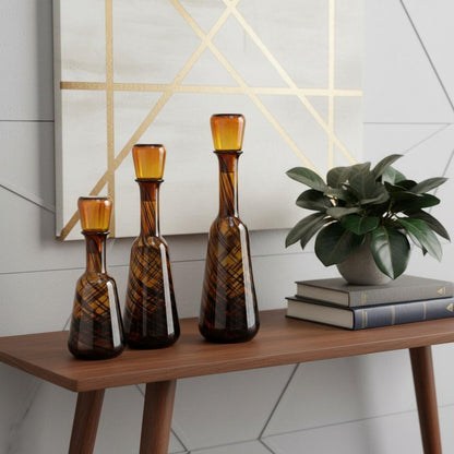 Set of Three Amber Abstract Swirl Glass Decorative Bottles With Stoppers HomeRoots
