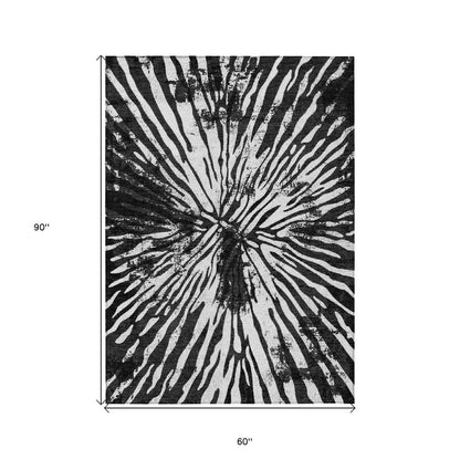 5' X 8' Black Charcoal And Ivory Abstract Washable Indoor Outdoor Area Rug