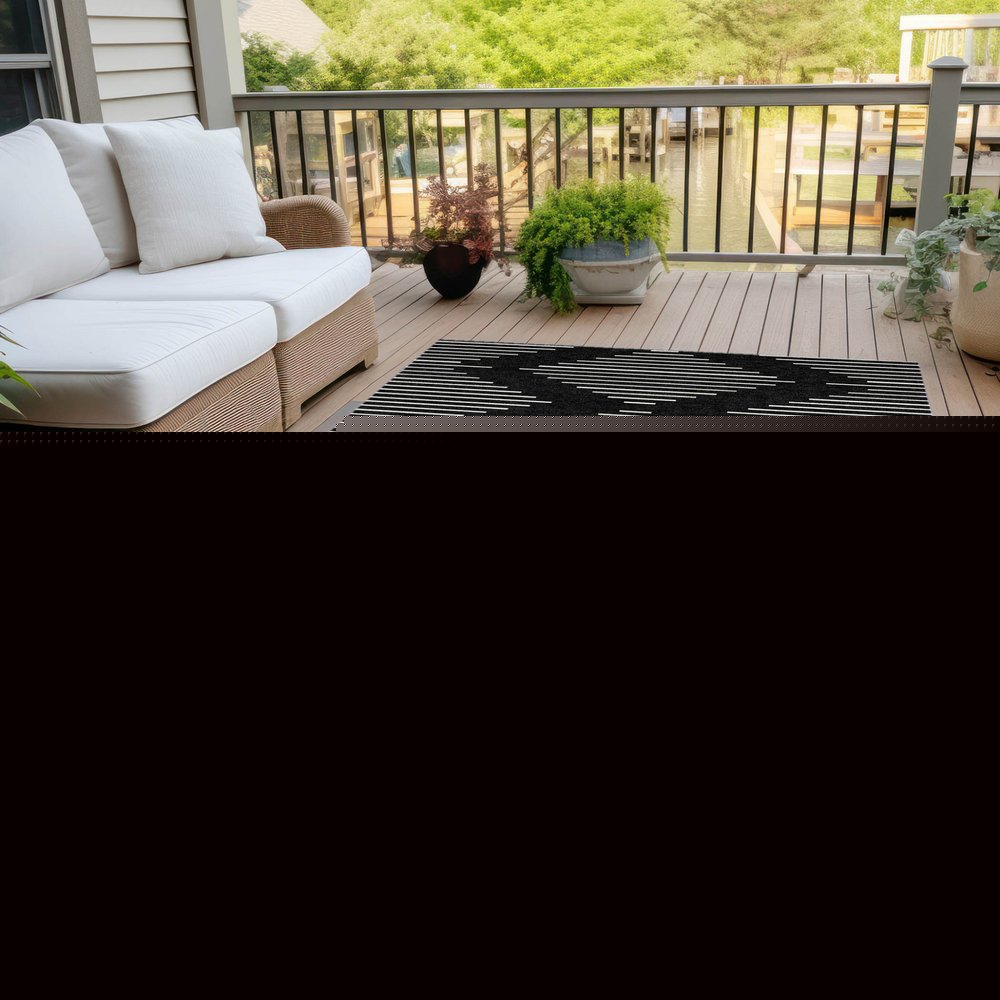 5' X 8' Black And Ivory Geometric Washable Indoor Outdoor Area Rug HomeRoots