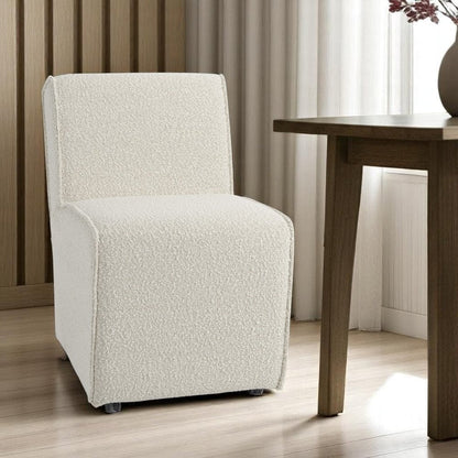 Set of Two Cream Boucle Swivel Dining Side Chairs With Wheels HomeRoots