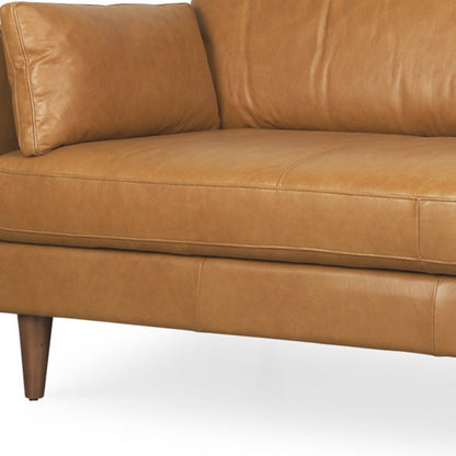 88" Tan Leather Sofa And Toss Pillows With Brown Legs HomeRoots