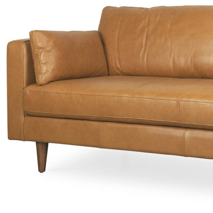 88" Tan Leather Sofa And Toss Pillows With Brown Legs HomeRoots
