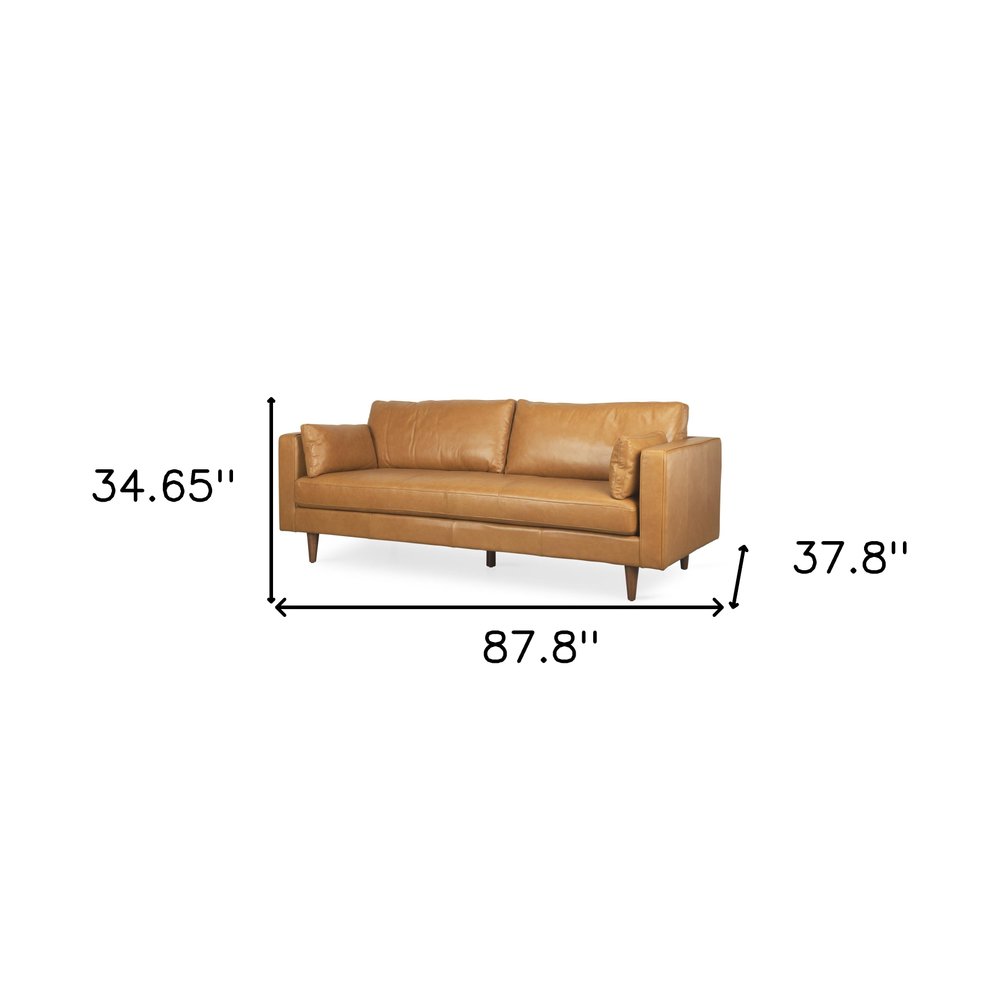 88" Tan Leather Sofa And Toss Pillows With Brown Legs HomeRoots