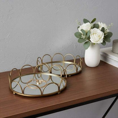 Set of Two Antiqued Gold Metal And Mirrored Glass Round Vanity Trays HomeRoots