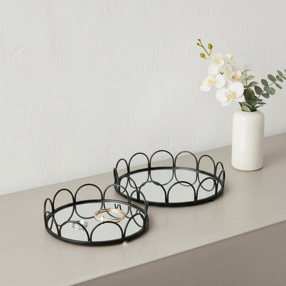 Set of Two Black And Silver Metal And Mirrored Glass Round Vanity Trays HomeRoots