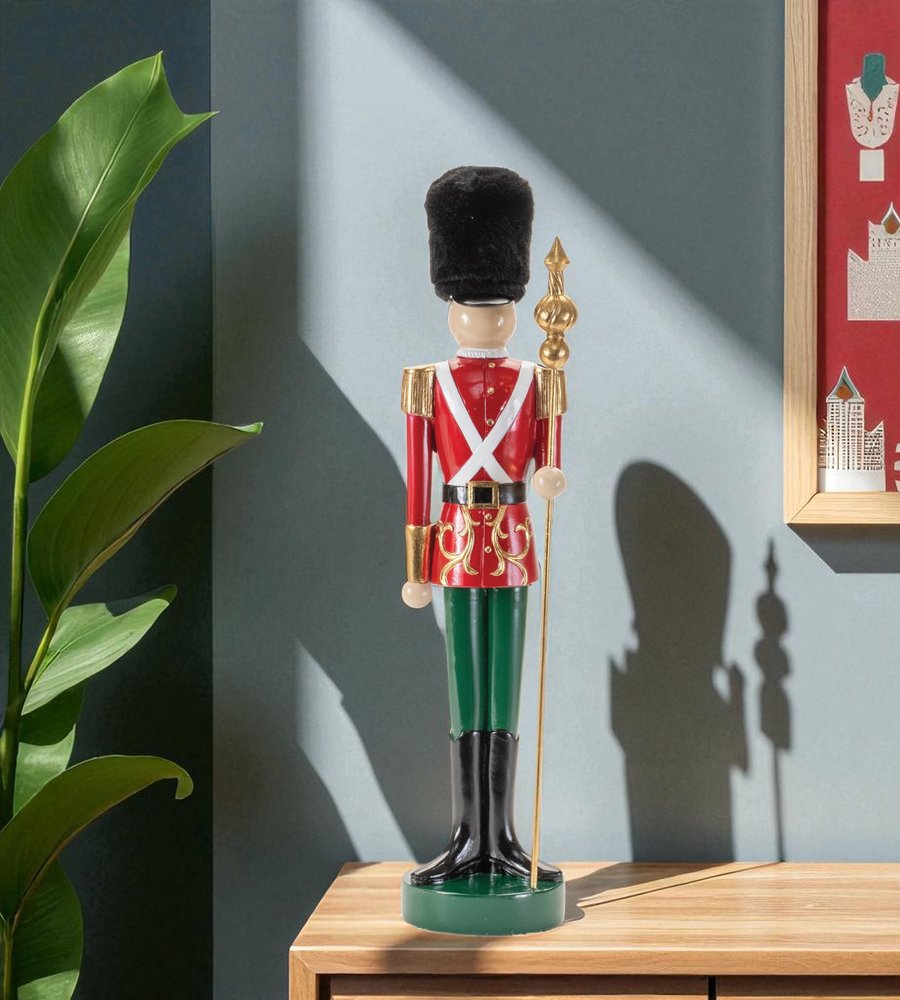 19" Black Red And Green Resin Christmas Nutcracker Tabletop Sculpture HomeRoots