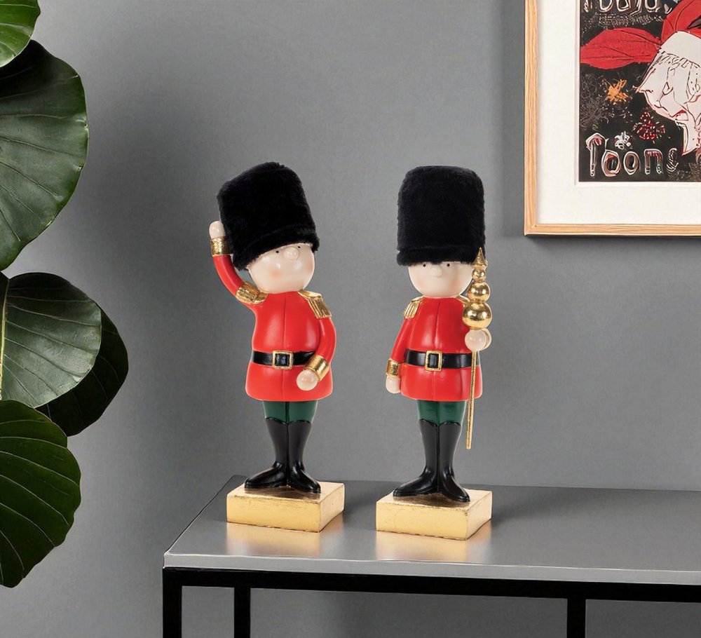 Set of Two Black Gold And Red Polyresin Christmas Nutcracker Figurines HomeRoots