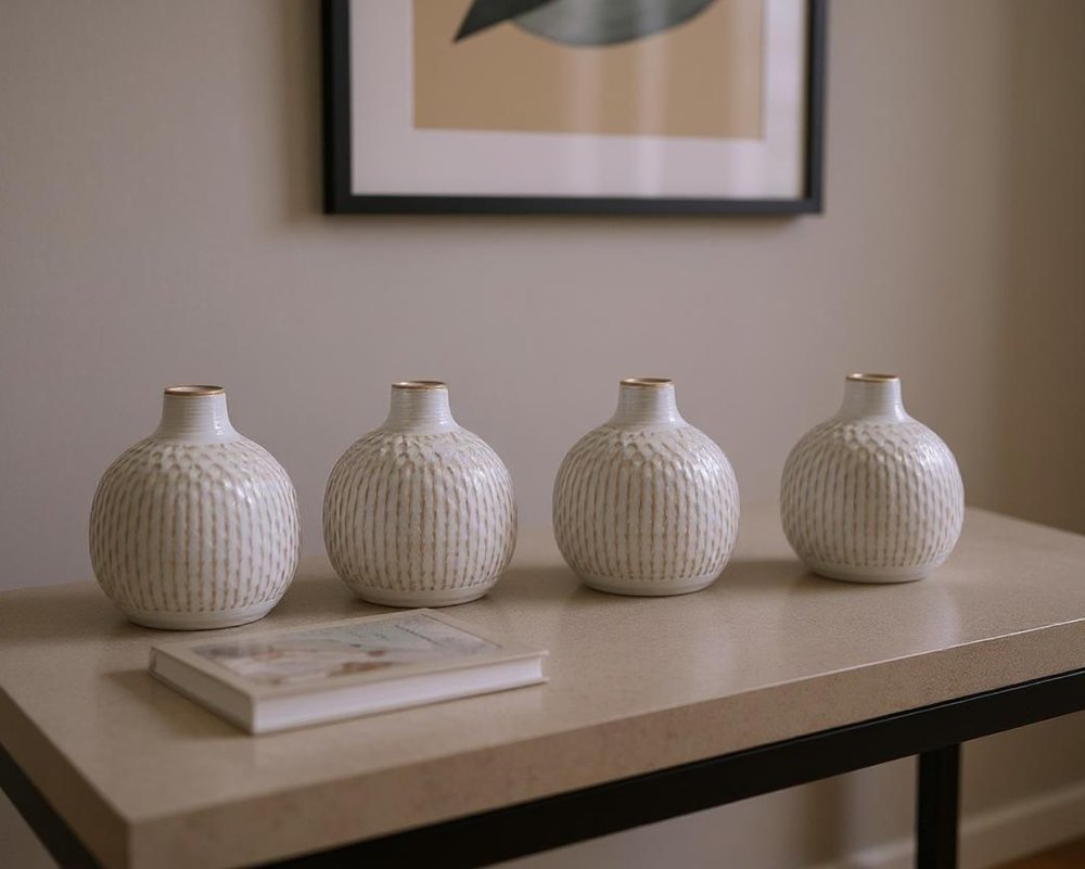 Set of Four Natural And Off White Ceramic Bud Vases With Sculptural Details HomeRoots