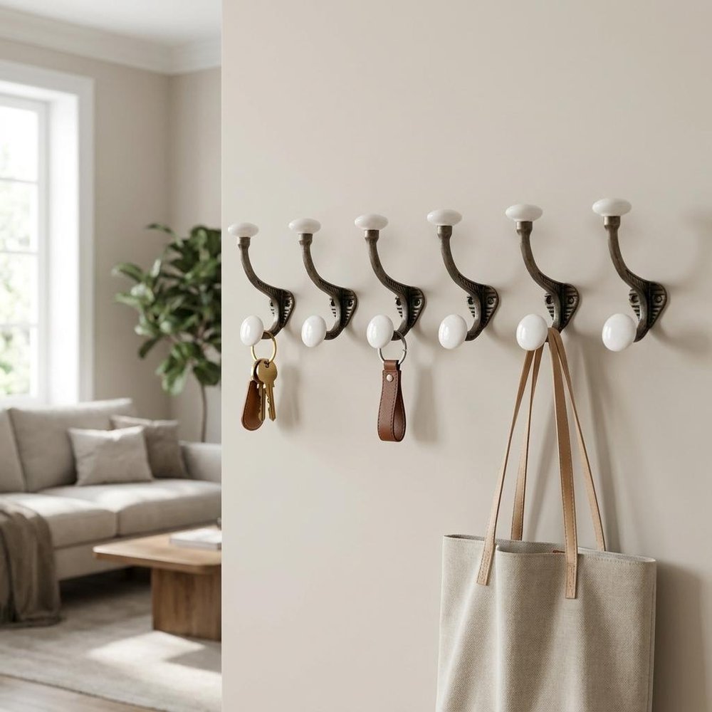 Set of Six Bronze And White Cast Iron And Ceramic Double Wall Hooks — view 7