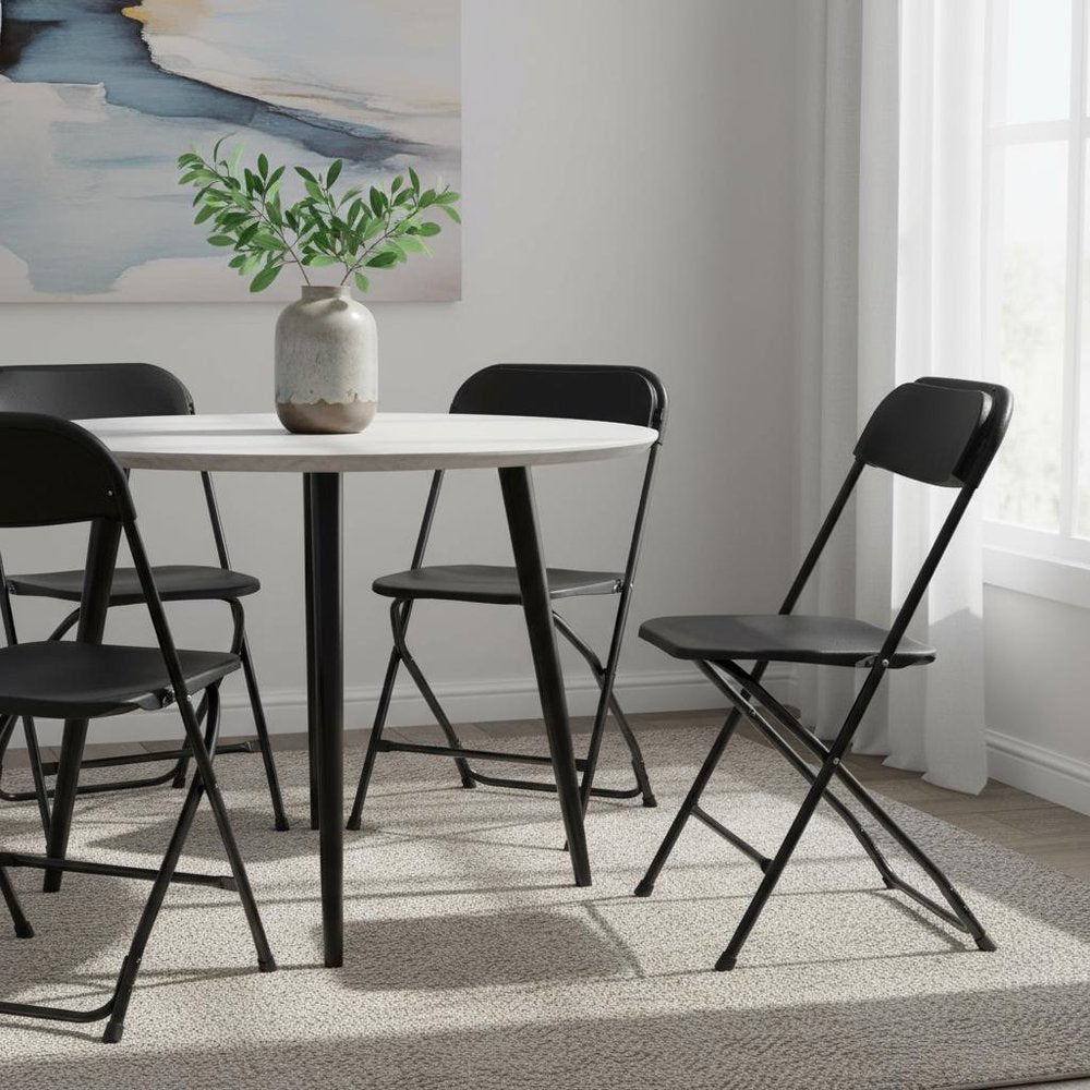 Set of Four Black Metal Outdoor Folding Stacking Dining Chairs HomeRoots