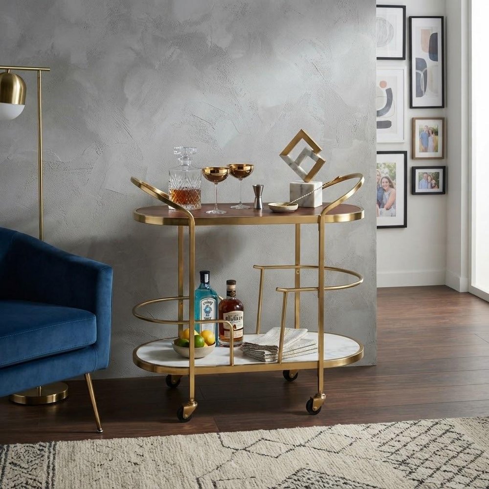 32" Brown Gold And White Iron Solid Wood and Marble Oval Rolling Bar Cart