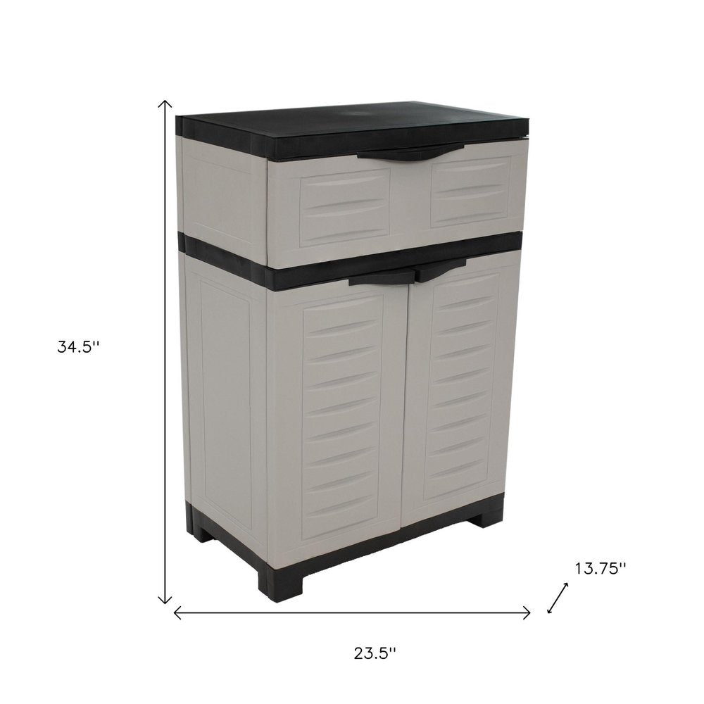 24" Gray Plastic Accent Cabinet With Two Doors And One Drawer HomeRoots