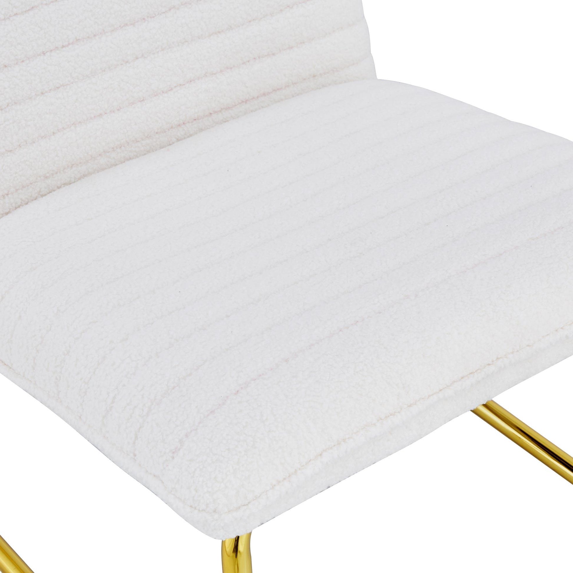 One White minimalist armless sofa chair with plush cushion and backrest paired with golden metal legs - FurniFindUSA