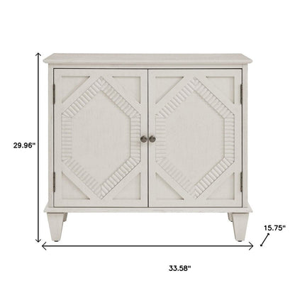 34" White Wood Carved Geometric Accent Cabinet With Two Doors HomeRoots