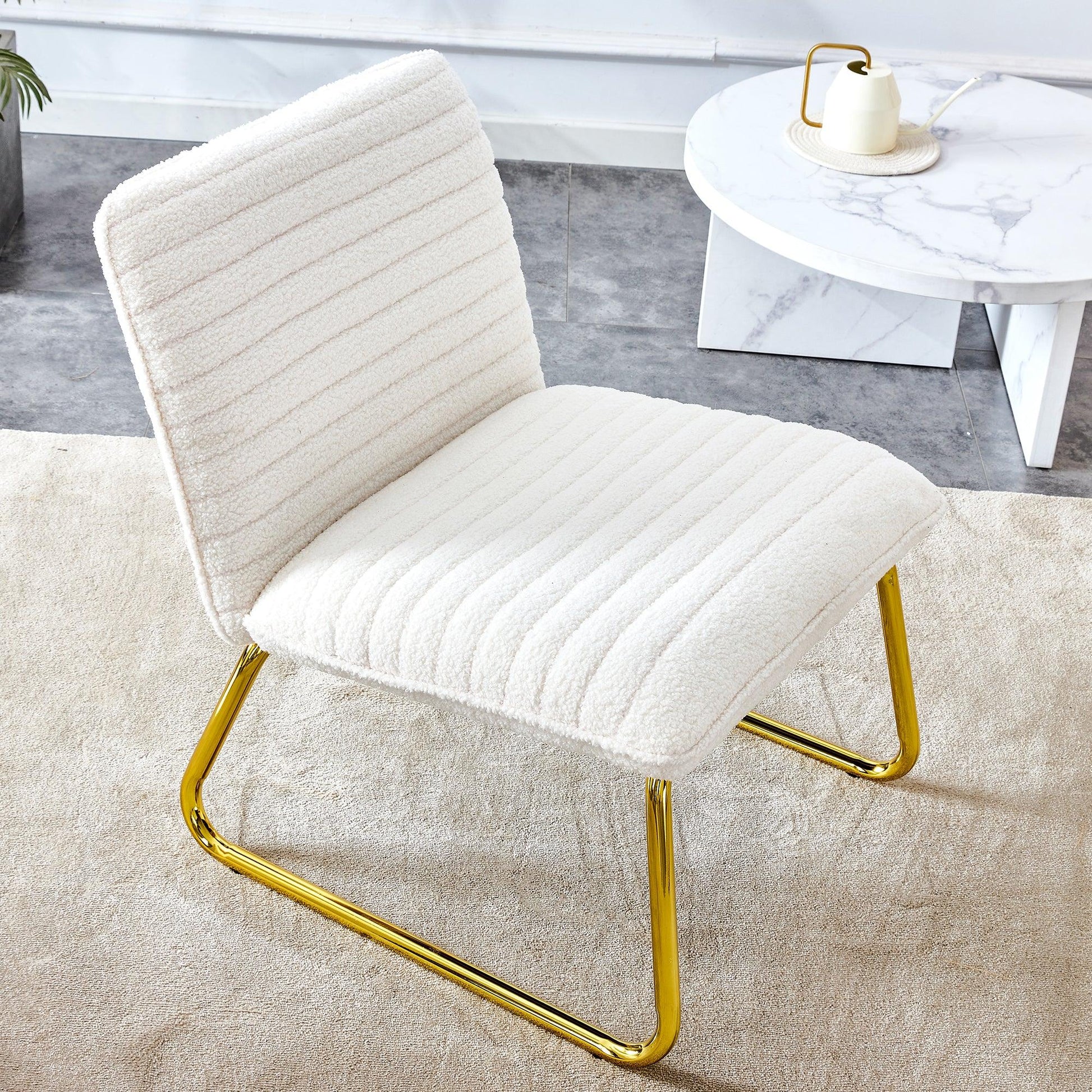 One White minimalist armless sofa chair with plush cushion and backrest paired with golden metal legs - FurniFindUSA