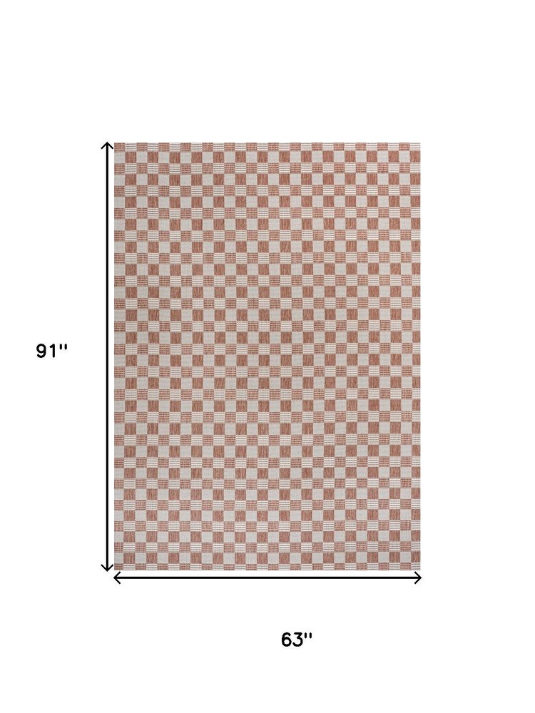5' X 8' Salmon And Cream Geometric Indoor Outdoor Area Rug