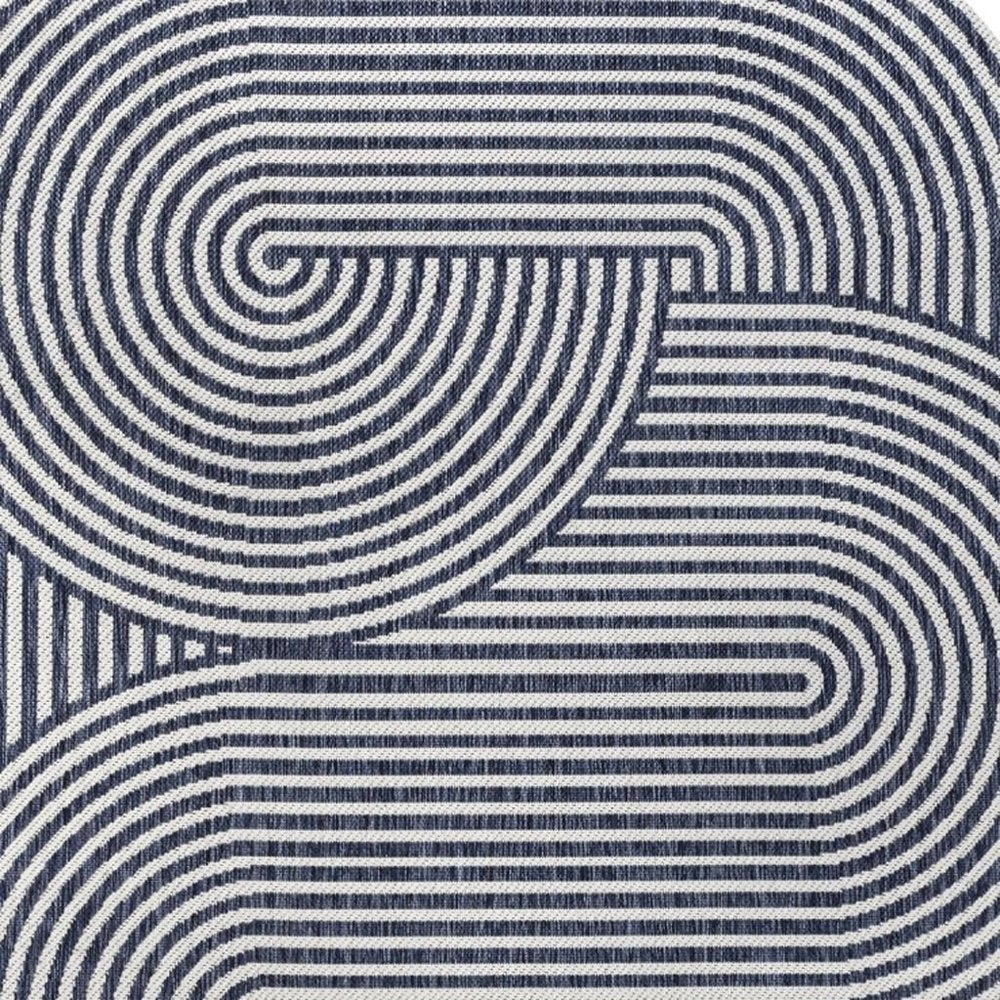 5' X 8' Cream And Navy Blue Abstract Indoor Outdoor Area Rug