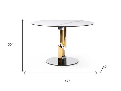 47" White Gold And Silver Ceramic Glass And Stainless Steel Pedestal Base Round Top Dining Table HomeRoots