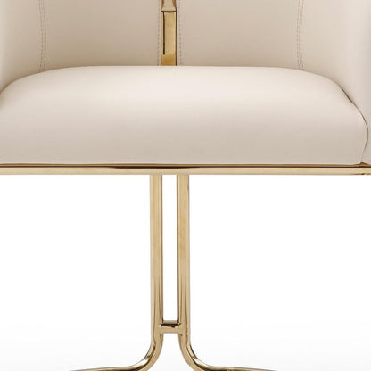 Beige and Gold Faux Leather and Metal Partially Open Back Dining Arm Chair HomeRoots