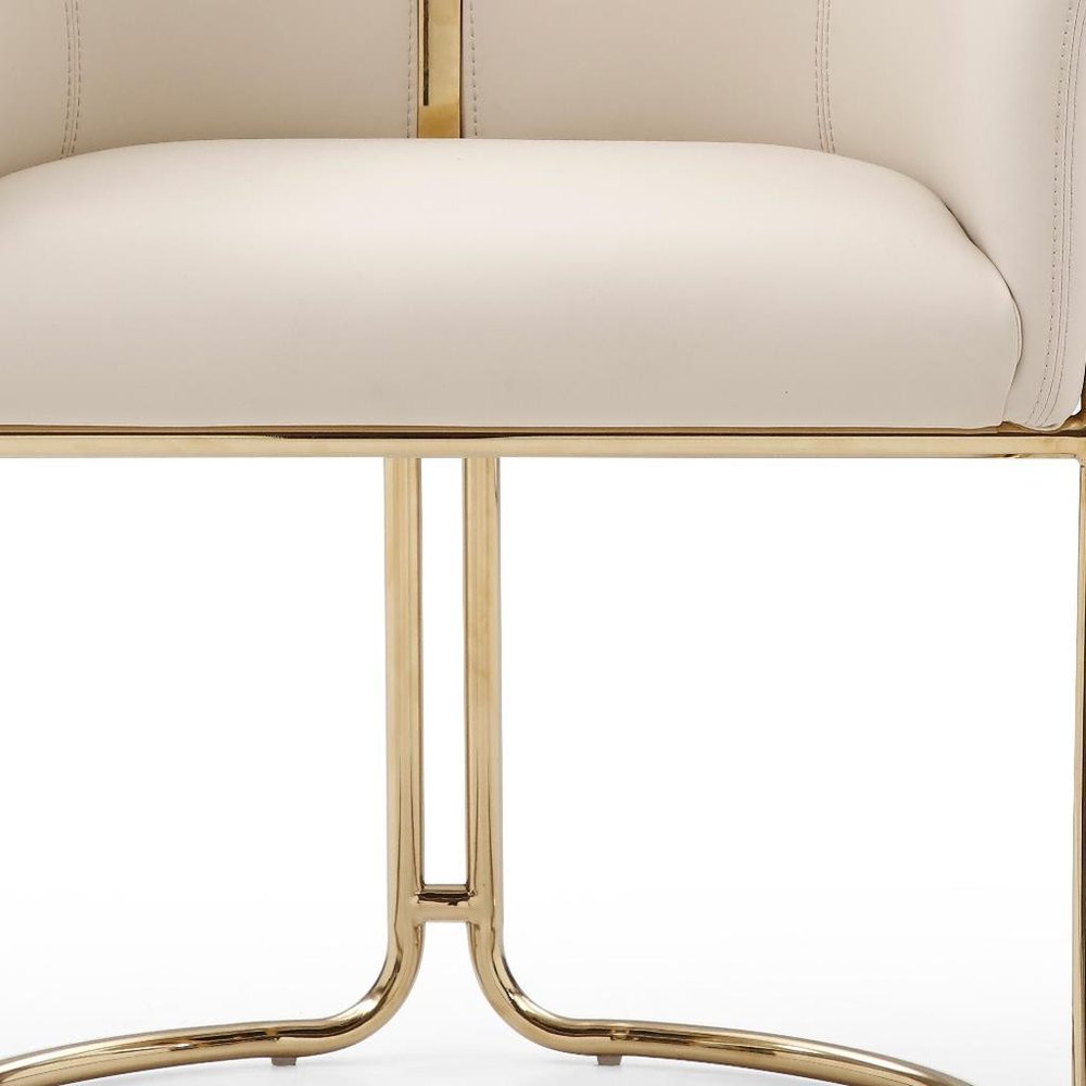 Beige and Gold Faux Leather and Metal Partially Open Back Dining Arm Chair HomeRoots