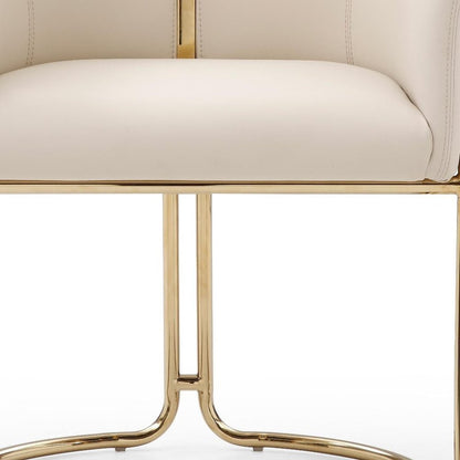 Beige and Gold Faux Leather and Metal Partially Open Back Dining Arm Chair HomeRoots
