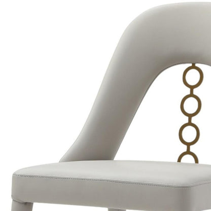 Set of Two Gray and Gold Faux Leather and Stainless Steel Dining Side Chairs HomeRoots