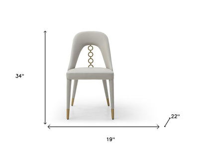 Set of Two Gray and Gold Faux Leather and Stainless Steel Dining Side Chairs HomeRoots