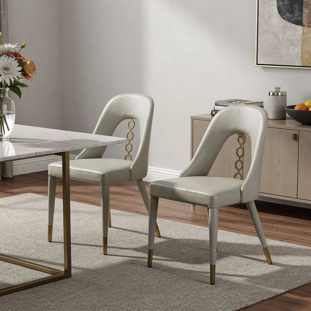 Set of Two Gray and Gold Faux Leather and Stainless Steel Dining Side Chairs HomeRoots