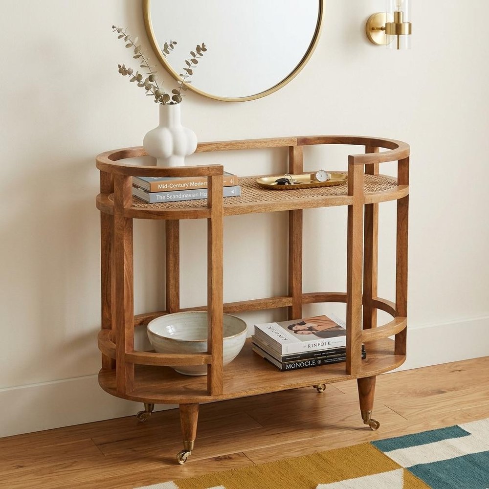 35" Golden Brown Rattan and Solid Wood Oval Wheel Console Table With Shelf HomeRoots