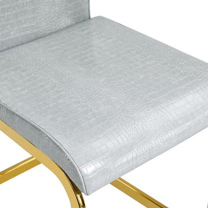Set of Four Gray And Silver Tufted Faux Leather And Metal Dining Side Chairs HomeRoots