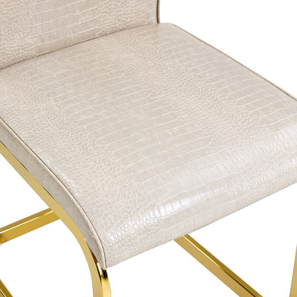 Set of Four Beige And Silver Tufted Faux Leather And Metal Dining Side Chairs HomeRoots