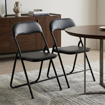 Set of Two Black Faux Leather and Steel Folding Chairs HomeRoots