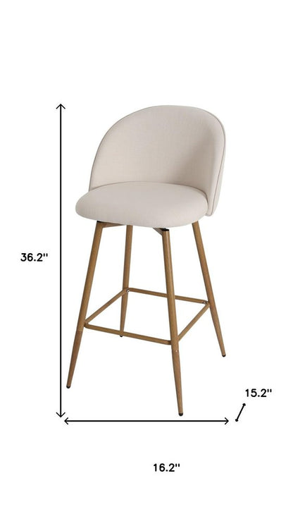 27" Beige And Oak Fabric And Metal Low Back Counter Height Swivel Bar Chair HomeRoots