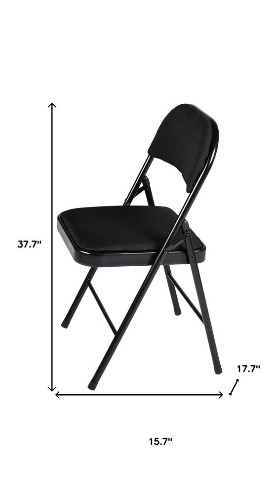 Set of Four Black Faux Leather and Steel Folding Chairs HomeRoots