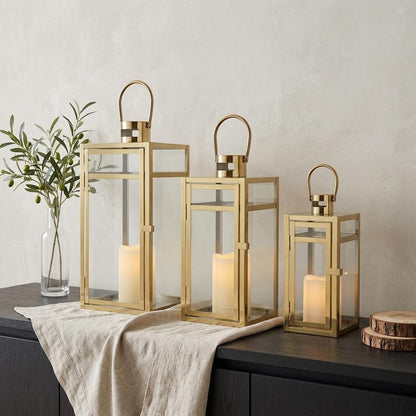 Set of Three Clear And Gold Glass And Stainless Steel Tabletop Lantern Candle Holders HomeRoots