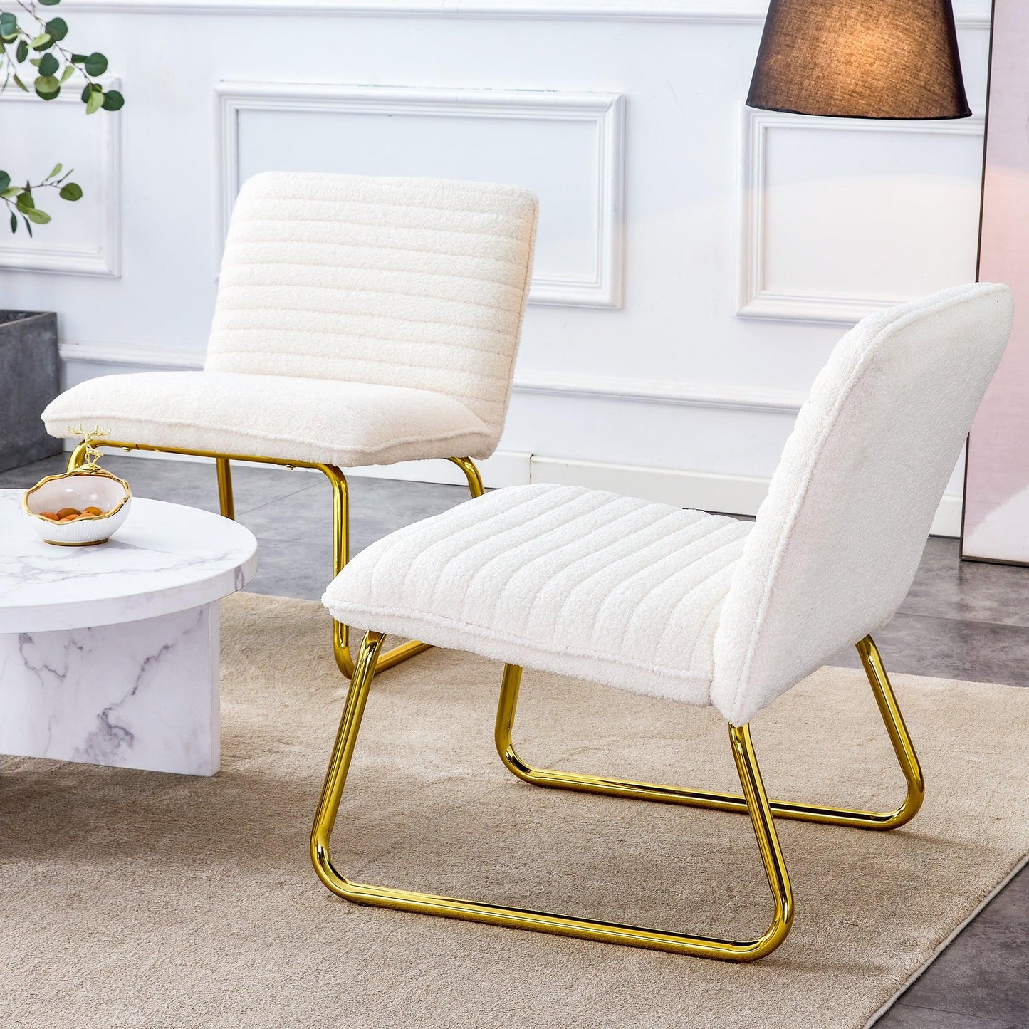 One White minimalist armless sofa chair with plush cushion and backrest paired with golden metal legs - FurniFindUSA