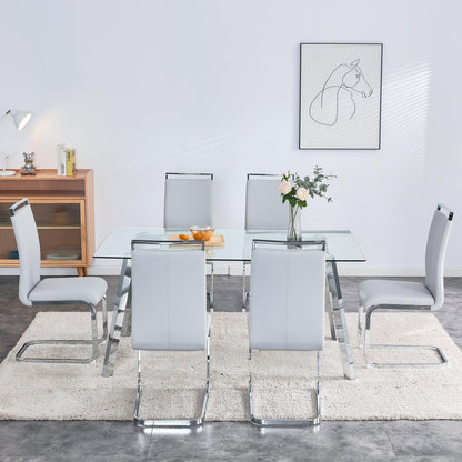 A modern minimalist rectangular glass dining table with tempered glass tabletop and silver metal legs - FurniFindUSA